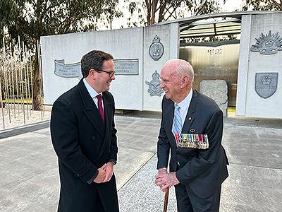 Minister Keogh standing with a Korean War veteran