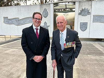 Minister Keogh standing with a Korean War veteran